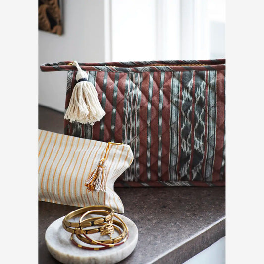 Quilted ikat washbag w/ tassel